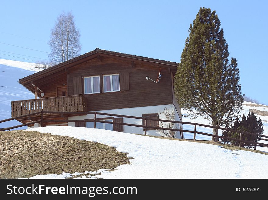 Swiss chalet in spring Alps. Swiss chalet in spring Alps