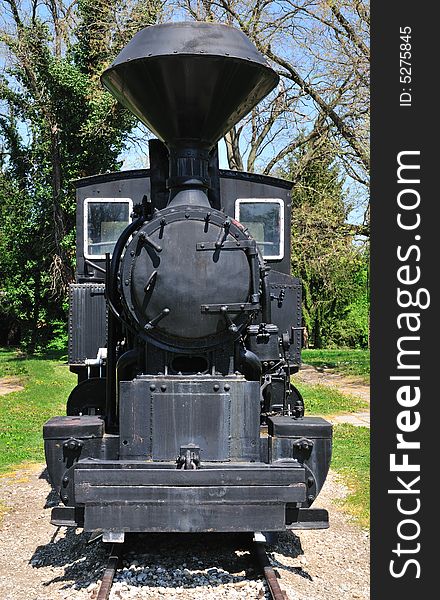 Very old steam locomotive close up at station. Very old steam locomotive close up at station.