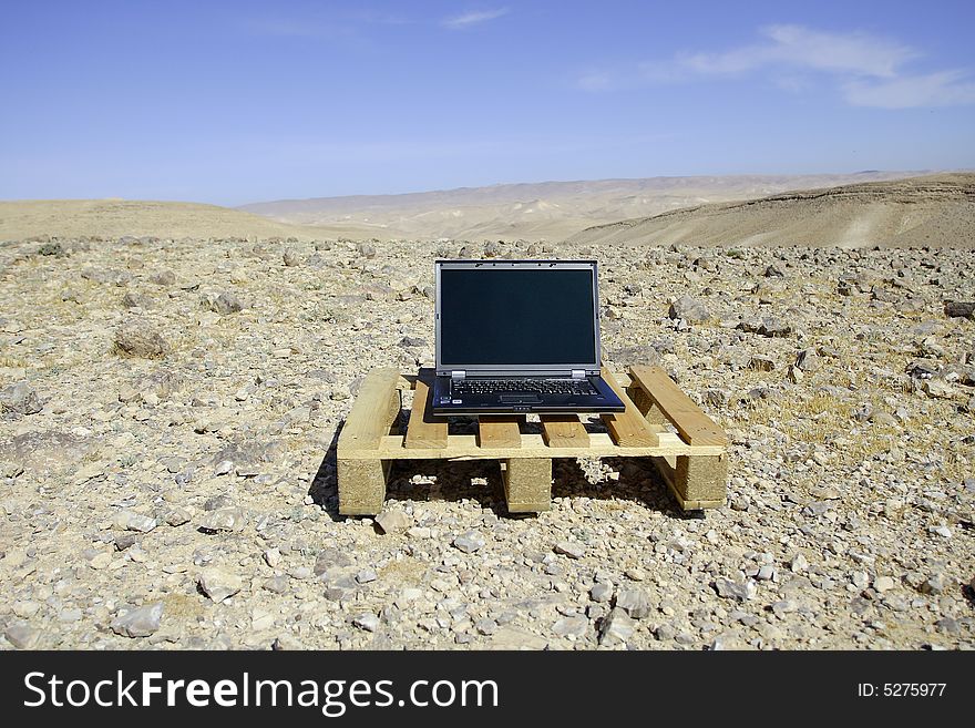 Opened laptop in Judean desert