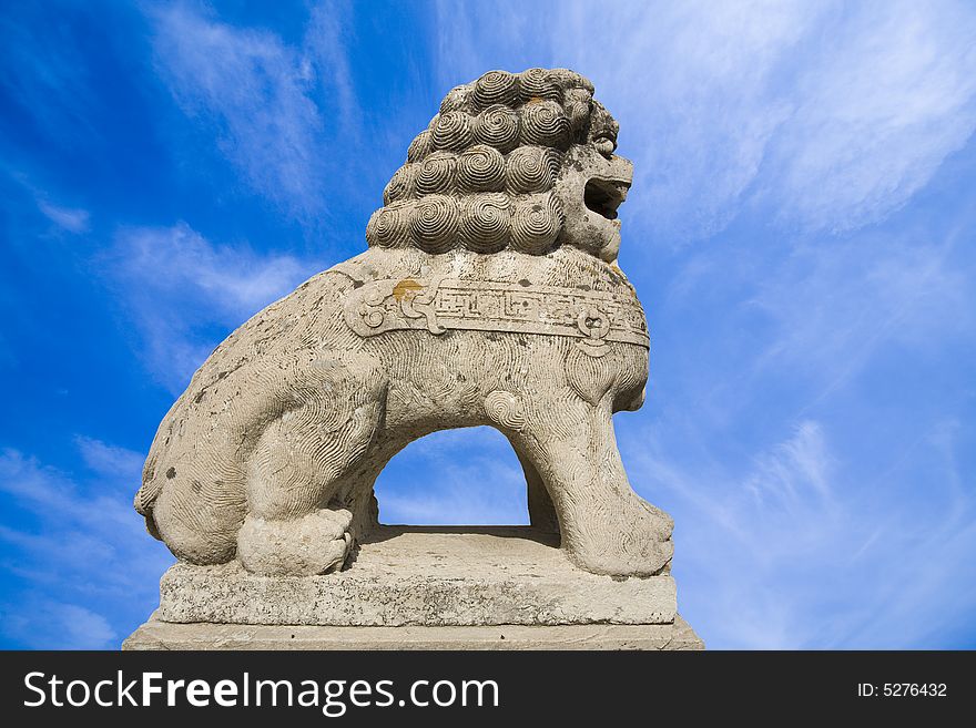 Stone sculpture lion at Chinaï¼Œisolated. Stone sculpture lion at Chinaï¼Œisolated