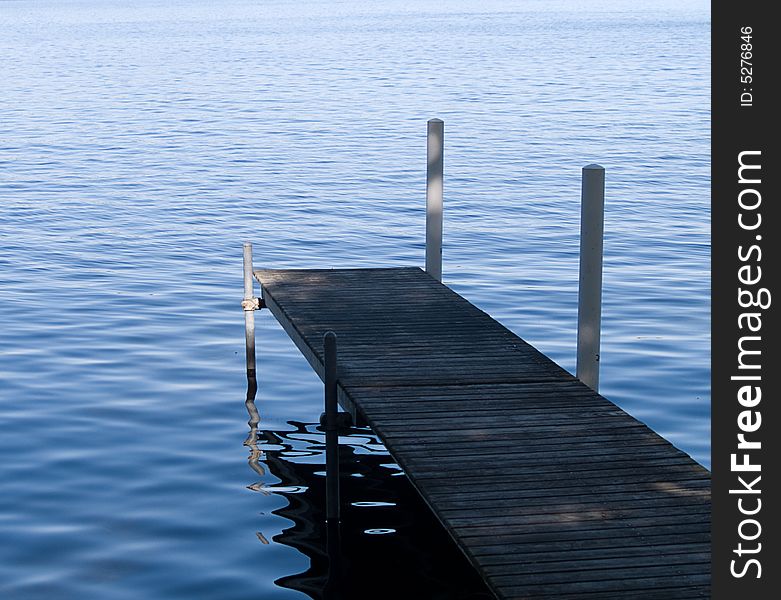 Taken in the morning, a pier allowing access to a lake. Taken in the morning, a pier allowing access to a lake.