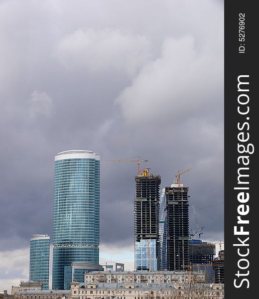 New buildings in Moscow. Construction. Clouds.