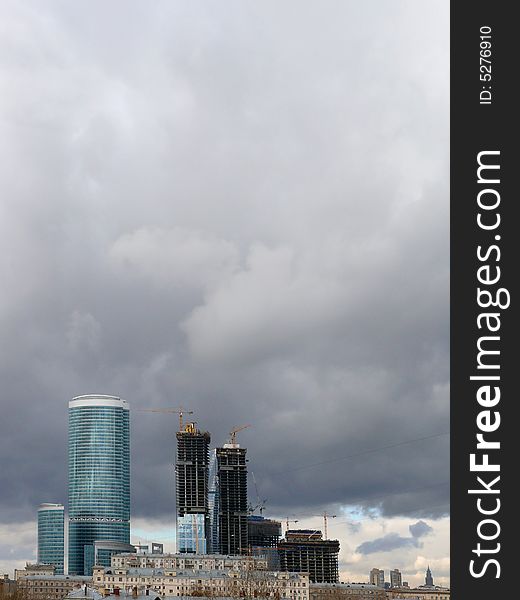 New buildings in Moscow. Construction. Clouds.