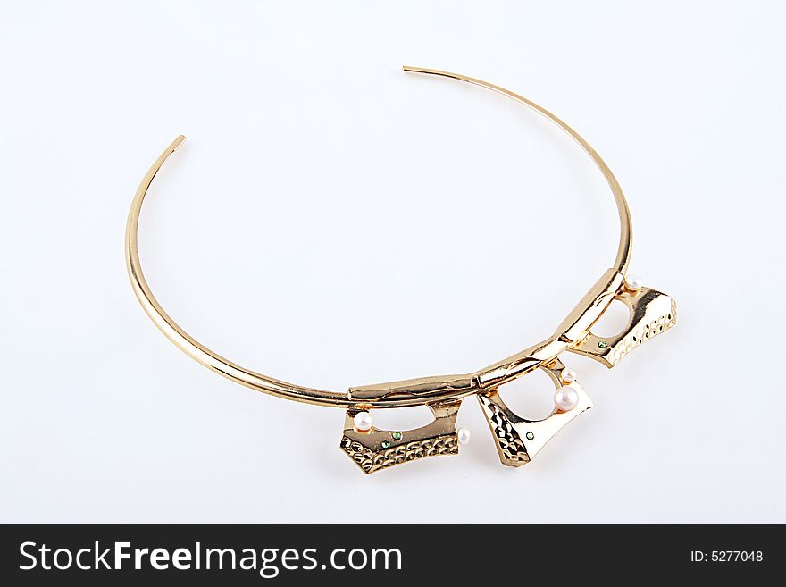 The Gold necklace uses for to dress up the woman to cause her to be more attractive