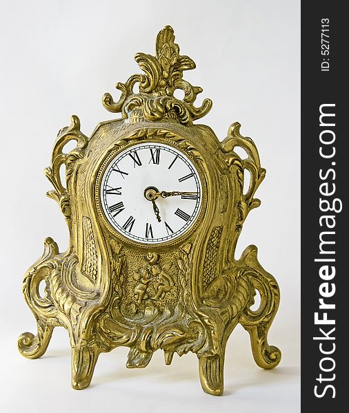 Vintage rich decorated baroque clock. Vintage rich decorated baroque clock