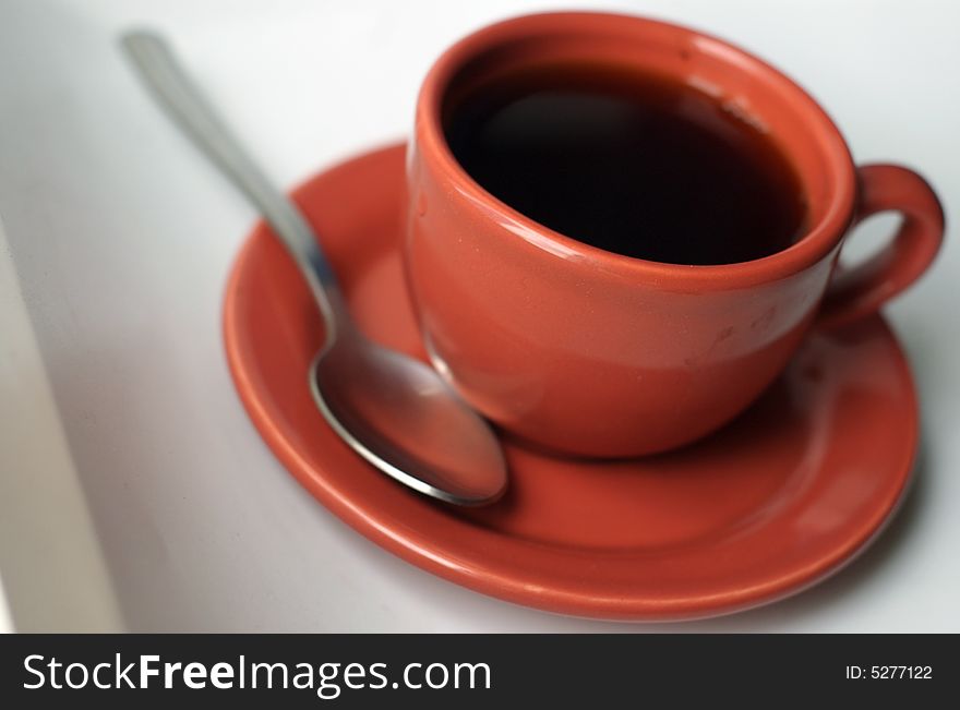 A small cup of coffee, espresso.