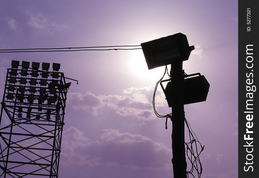 A silhouette of group of flood-lights and spot light. A silhouette of group of flood-lights and spot light