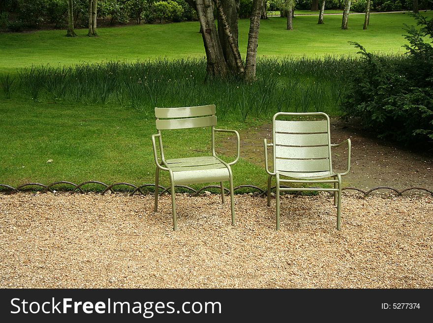 Two chairs in Jardin du Luxembourg, Paris, France. Two chairs in Jardin du Luxembourg, Paris, France
