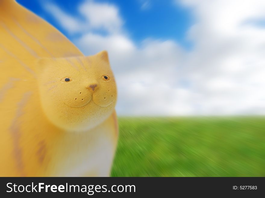 Cat figure over abstract of cloudy sky and grass. Cat figure over abstract of cloudy sky and grass