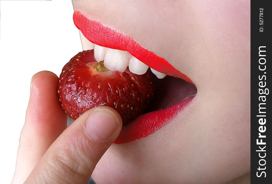 Taste strawberry in woman mouth