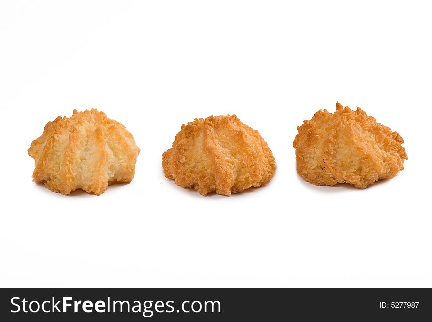 Three coconut cookies, on white background photo