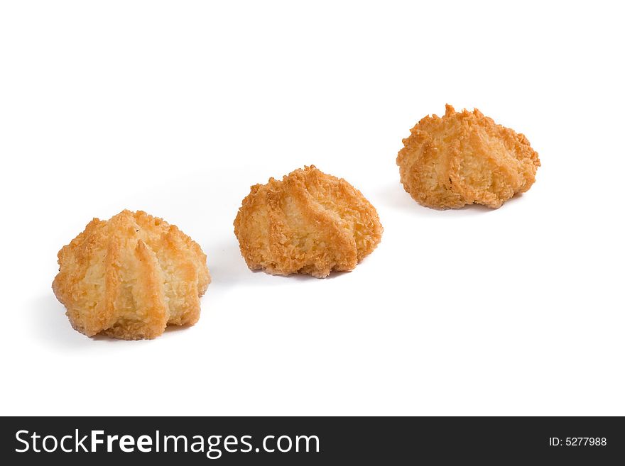 Three coconut cookies, on white background photo