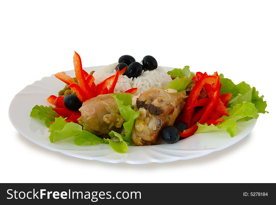 Rice and fried chicken with vegetable (lettuce, pepper,  olives and green peas) decoration. Rice and fried chicken with vegetable (lettuce, pepper,  olives and green peas) decoration.
