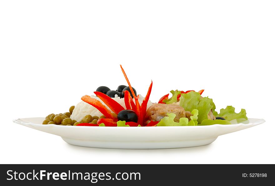 Rice and fried chicken with vegetable (lettuce, pepper,  olives and green peas) decoration. Rice and fried chicken with vegetable (lettuce, pepper,  olives and green peas) decoration.