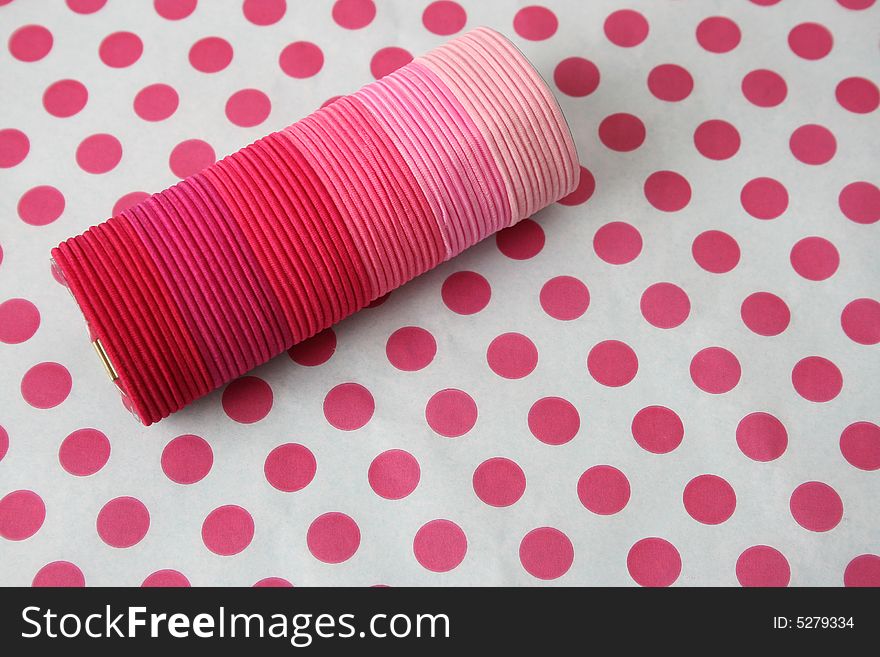 Variation of Pink Hairbands on pink polka-dot background