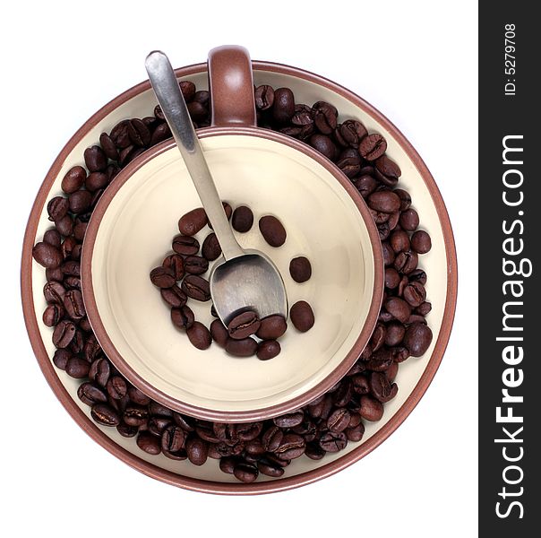 Cup saucer with spoon and coffee beans. Cup saucer with spoon and coffee beans