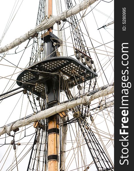 A sailing ships mast, rigging and crows nest. A sailing ships mast, rigging and crows nest
