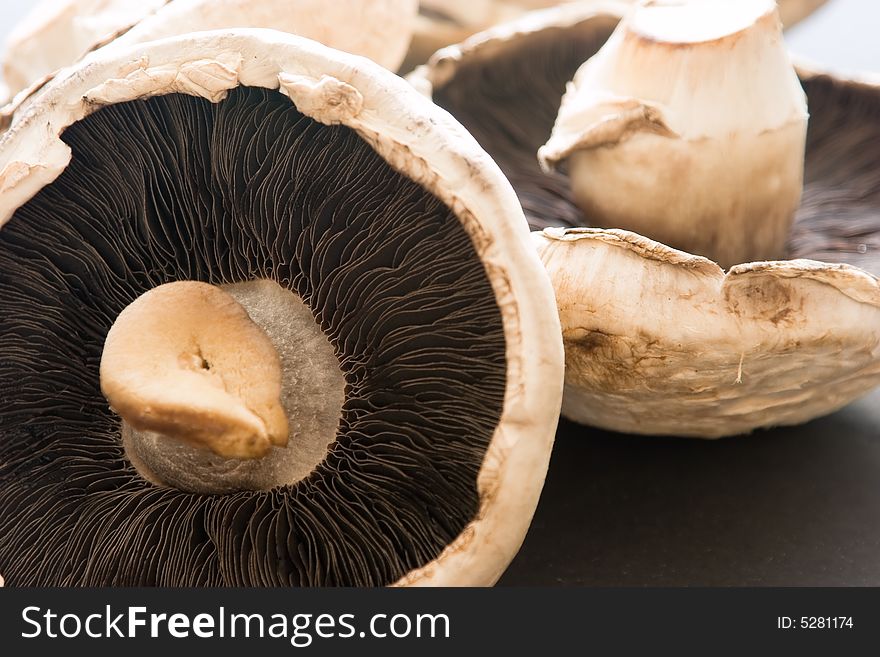 A bunch of mushrooms on a dark background