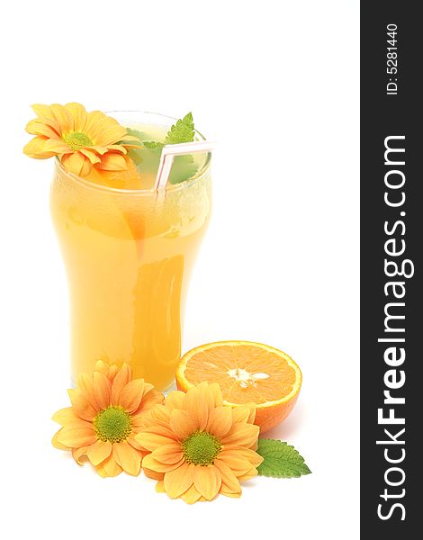 Glass of orange juice,flowers and fresh mint against white background. Glass of orange juice,flowers and fresh mint against white background