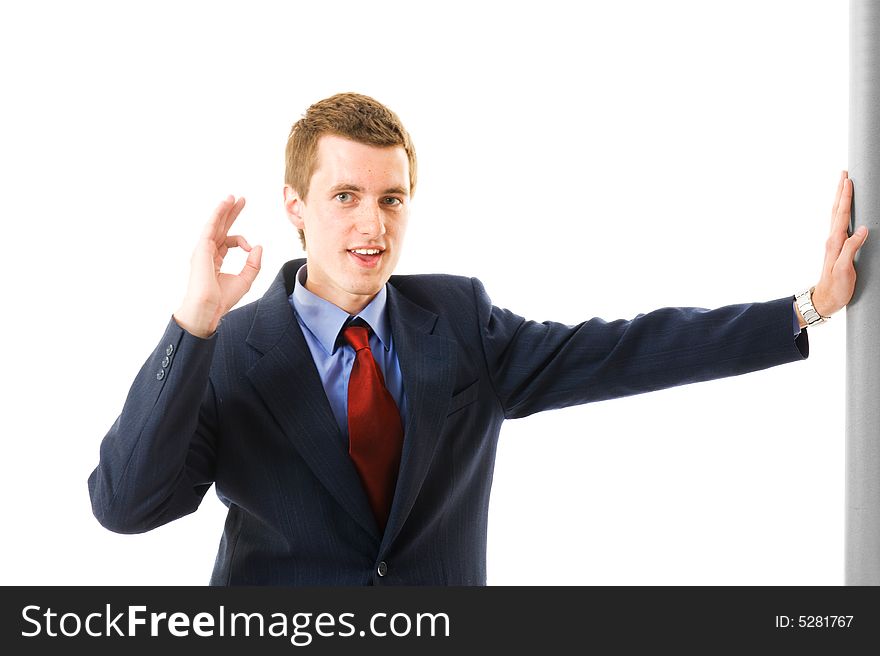 Young businessman showing thumb up and smile. Sign Yes. Isolated on white background