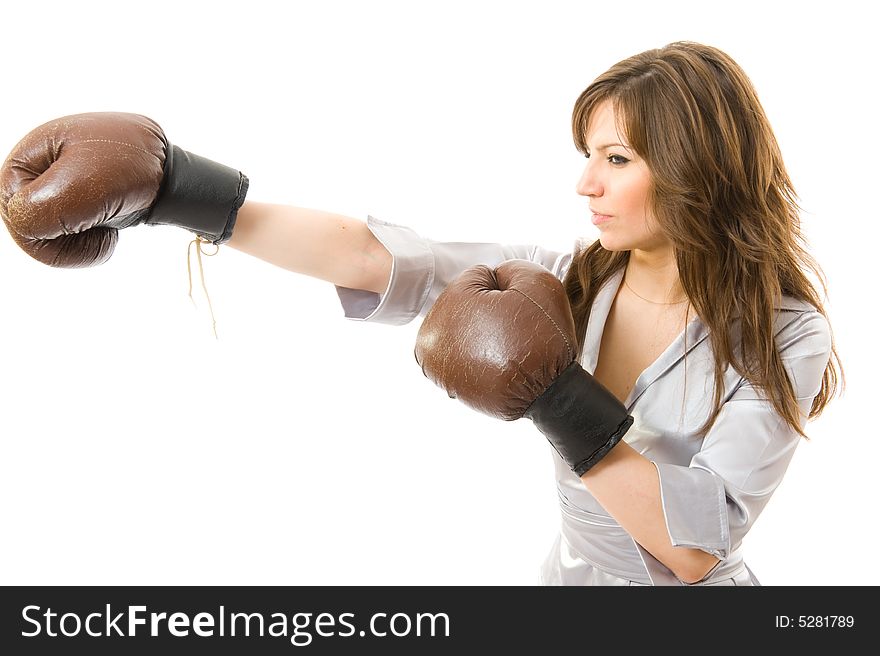 The young businesswoman Attacks from competitors. Isolated on white background