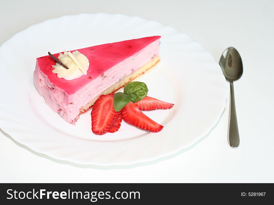 Slice of  cake with strawberry, selective focus, flash. Slice of  cake with strawberry, selective focus, flash