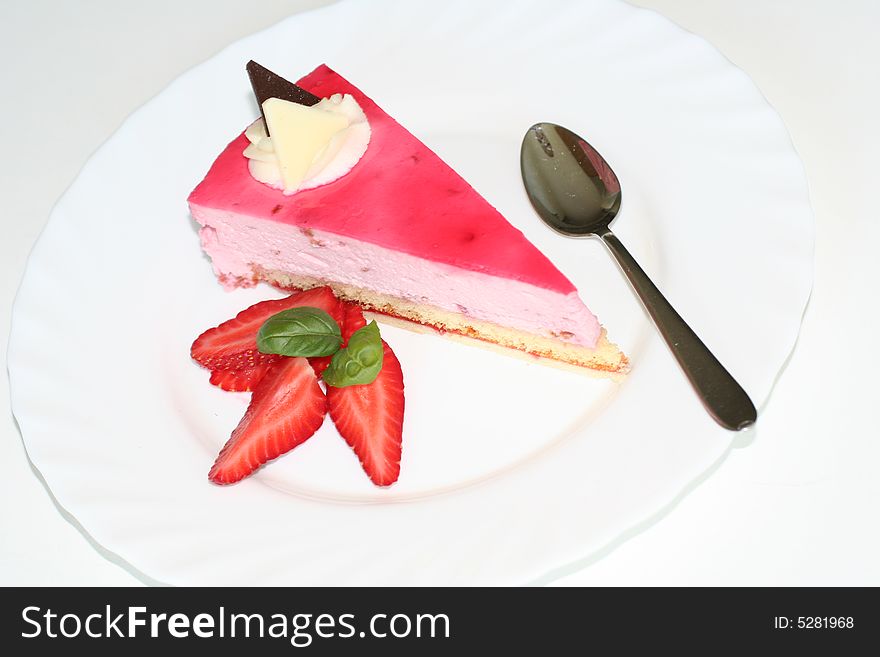 Slice of cake with strawberry, selective focus, flash. Slice of cake with strawberry, selective focus, flash