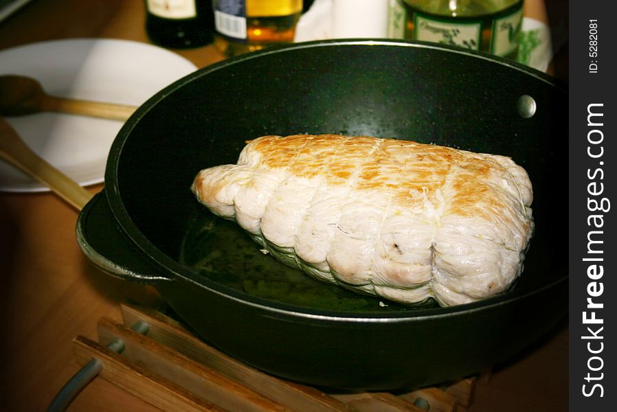 Roasted veal roll in a pan