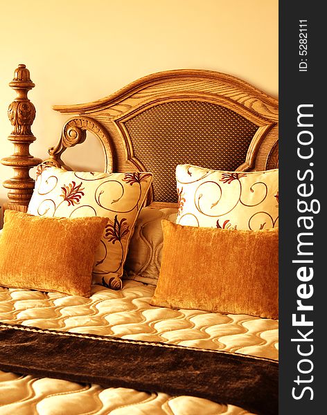 Colorful cushions on the bed