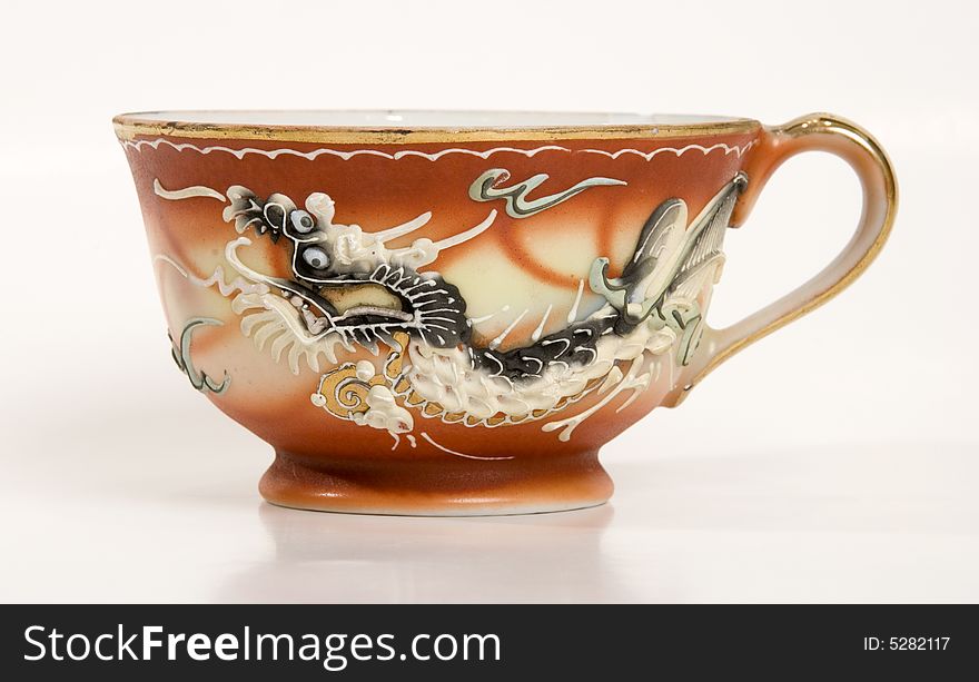 A unique tea cup with dragon design no saucer. A unique tea cup with dragon design no saucer