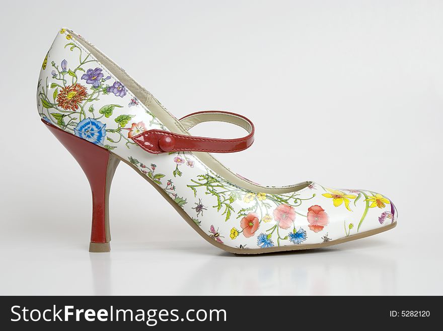 Close up of a woman's shoe with an unusual floral pattern. Close up of a woman's shoe with an unusual floral pattern