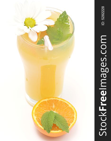Glass of orange juice,flower and fresh mint against white background. Glass of orange juice,flower and fresh mint against white background