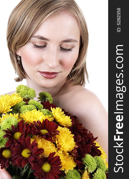 Beautiful young blonde woman with natural makeup holding a bouquet of flowers. Beautiful young blonde woman with natural makeup holding a bouquet of flowers
