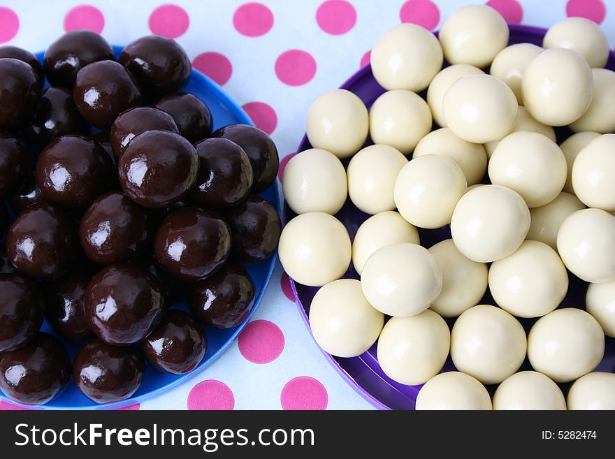 Vanilla and Dark Chocolate balls on a polka-dot background