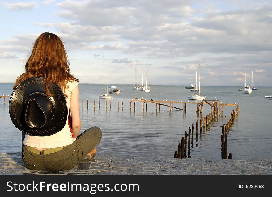 Back of girl looking for sea travel. Back of girl looking for sea travel