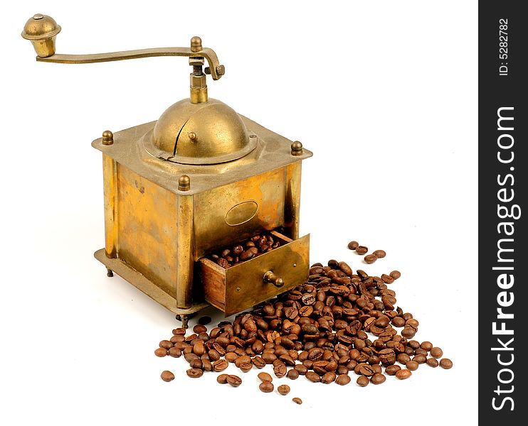 Antiquity coffee machine with beans over white