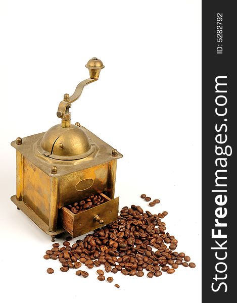 Antiquity coffee machine with beans over white