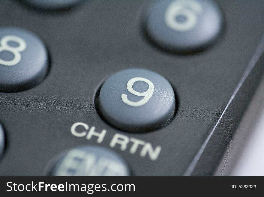 A close up of a number nine button on a remote control