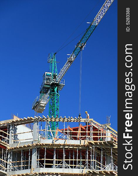 Construction crane against clear blue sky