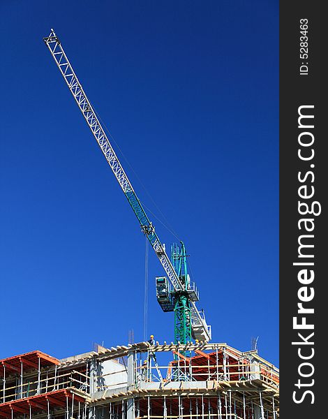 Construction crane against clear blue sky