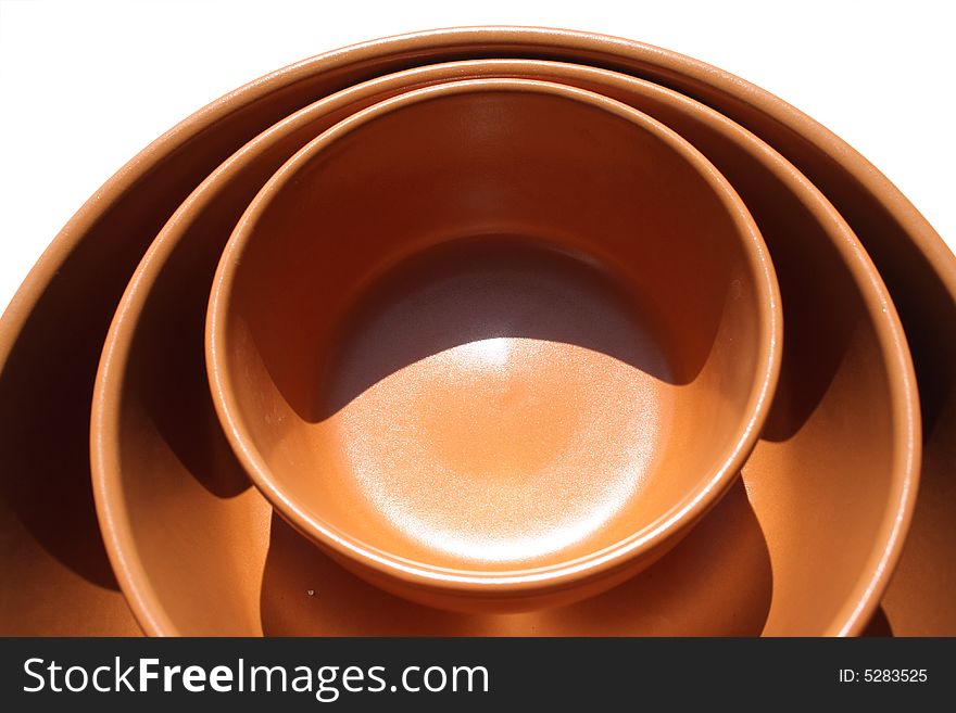 Empty brown ceramic salad plate isolated on white. Empty brown ceramic salad plate isolated on white