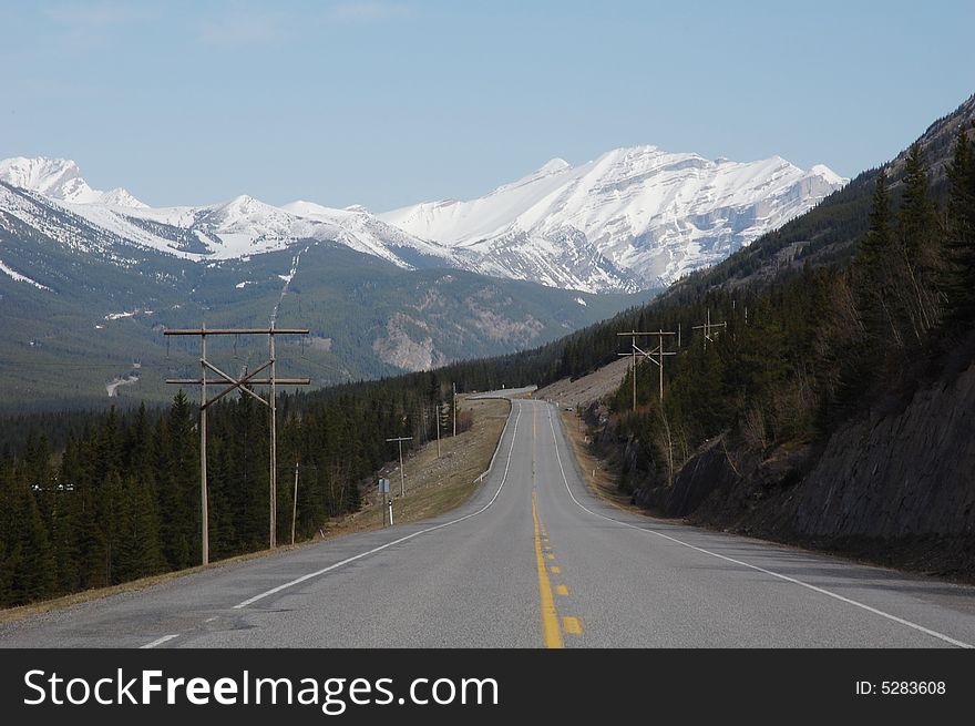 Landscape of spring rocky mountain and highway in kananaskis county, alberta, canada