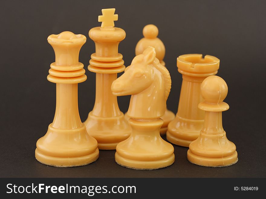 Set of white chess figures on dark background. Set of white chess figures on dark background