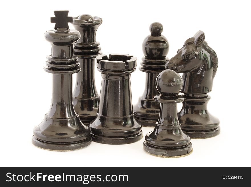 Black chess pieces on a white background. Black chess pieces on a white background