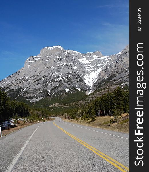 View of rocky mountain and winding highway in kananaskis county, alberta, canada