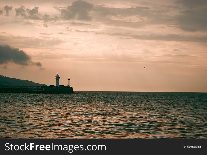 Cloudy sunrise above seamark, Yalta