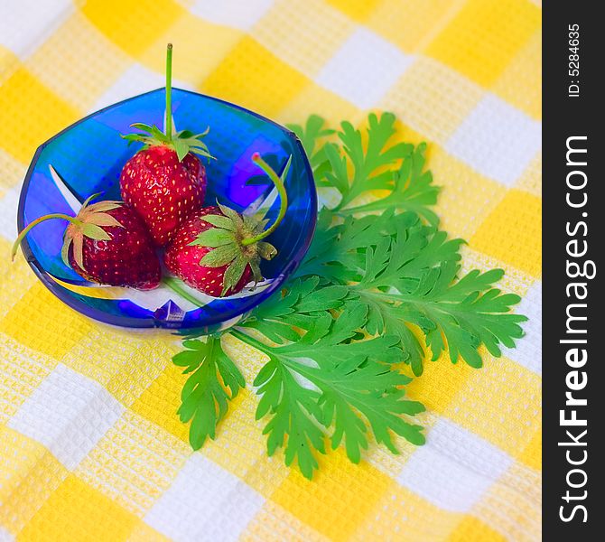 Three Strawberries lying on plate