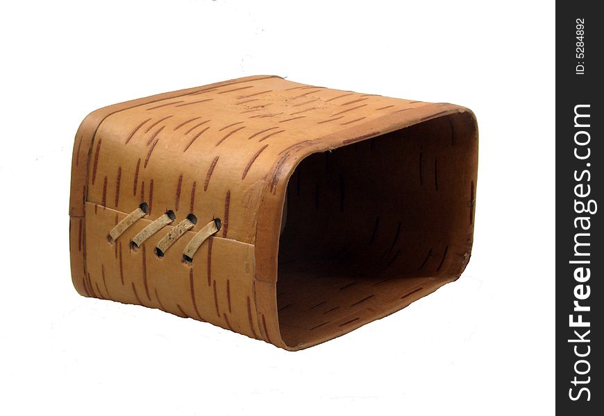 The box made manually from a bark of a birch, for different trifles, on a white background. The box made manually from a bark of a birch, for different trifles, on a white background
