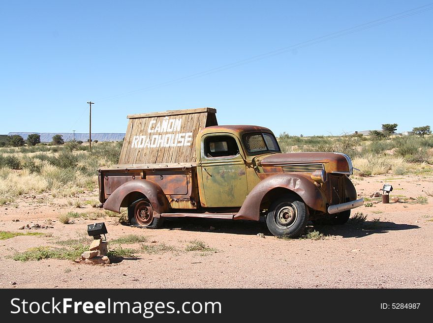 Old vehicle used as a sign post in the middle of no-where. Old vehicle used as a sign post in the middle of no-where