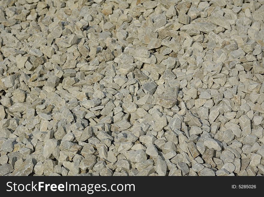 Crushed stone background. Gray granite. Crushed stone background. Gray granite